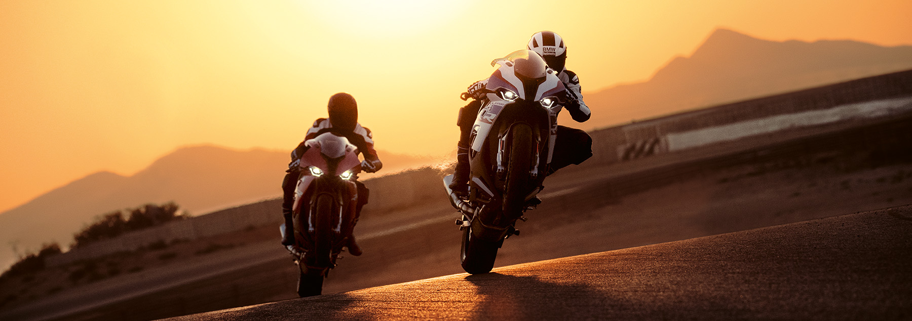 Two BMW Motorcycles riding during sunset in Southern California.
