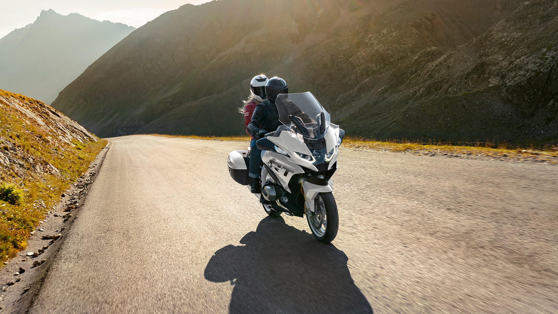 A BMW R 1250 RT being ridden on a road.