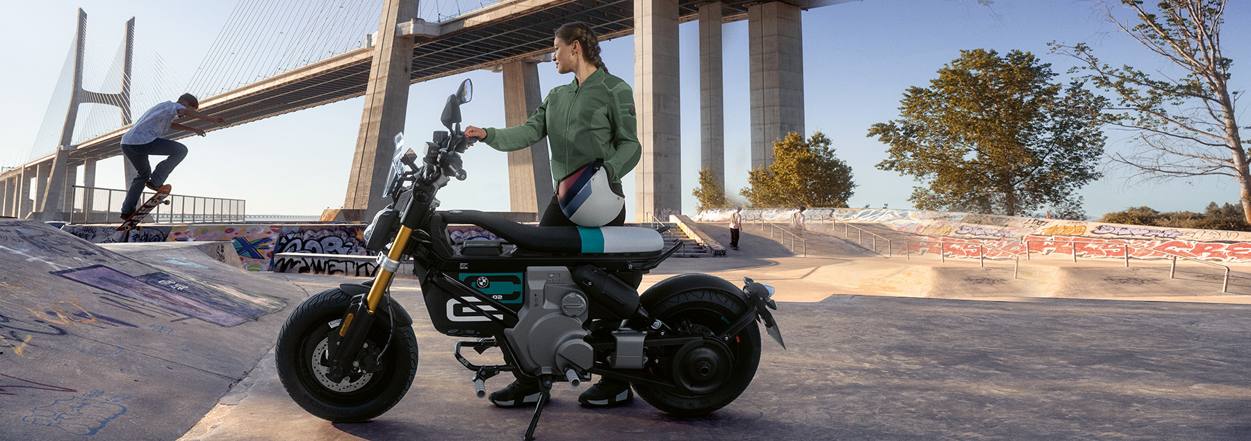 A rider standing next to her BMW Motorcycle in Southern California